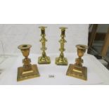 2 pairs of brass candlesticks.