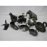 A quantity of pewter animals including dog, cockerel pepperettes, swans, elephants etc., some a/f.