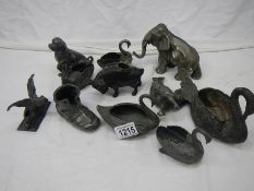 A quantity of pewter animals including dog, cockerel pepperettes, swans, elephants etc., some a/f.