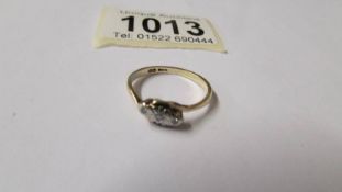 A circa 1940's 3 stone diamond ring, platinum set and gold shank, size N.