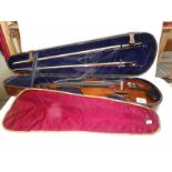 An old violin in wooden case - violin has label reading 'The Antiquary 1763' and a signature in pen