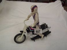 An Evil Knievel 1970's doll and bike.