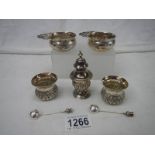 7 items of hall marked silver including 2 pairs of salts with spoons and a salt cellar.