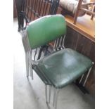 A set of 4 chrome and leather chairs