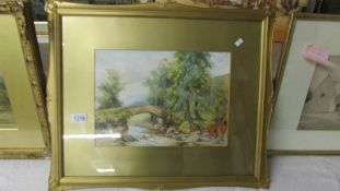 A framed and glazed watercolour 'Bridge over River' signed P yolinson 1922. Image 36 x 26cm.