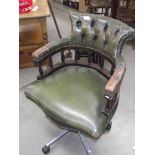 A green leather deep buttoned swivel office chair (collect only).