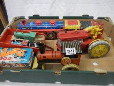 A mixed lot of tinplate and plastic friction and clockwork toys including Marx.