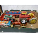 A mixed lot of tinplate and plastic friction and clockwork toys including Marx.