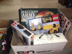 A box of Lego and Meccano.