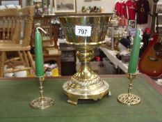 A Victorian Gothic brass oil lamp base and a pair of modern candlesticks.