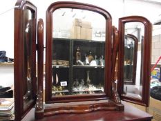 A mahogany triple bevel edged toilet mirror,