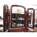 A mahogany triple bevel edged toilet mirror,