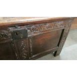 A carved oak coffer.