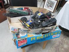 A quabtity of remote control cars, spares etc,