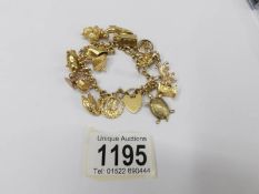 A 9ct gold charm bracelet, 34 grams.