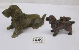 A 1920's spelter ashtray in the form of a spaniel and a dog lighter.
