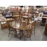 An oak gateleg table and a set of 6 wheelback dining chairs (collect only).