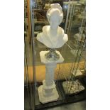 A female bust with marble base on Corinthian style stand.