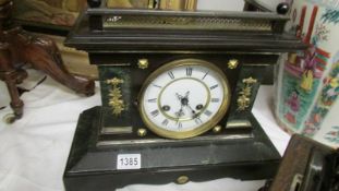 A Victorian palladian style mantel clock.