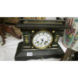 A Victorian palladian style mantel clock.