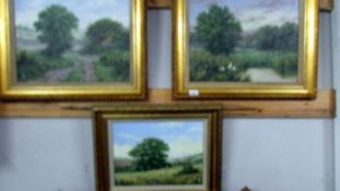 A pair of gilt framed landscape oils on canvas,