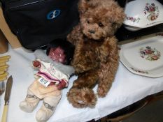 A limited edition 'Charlie' bear and a costume doll.