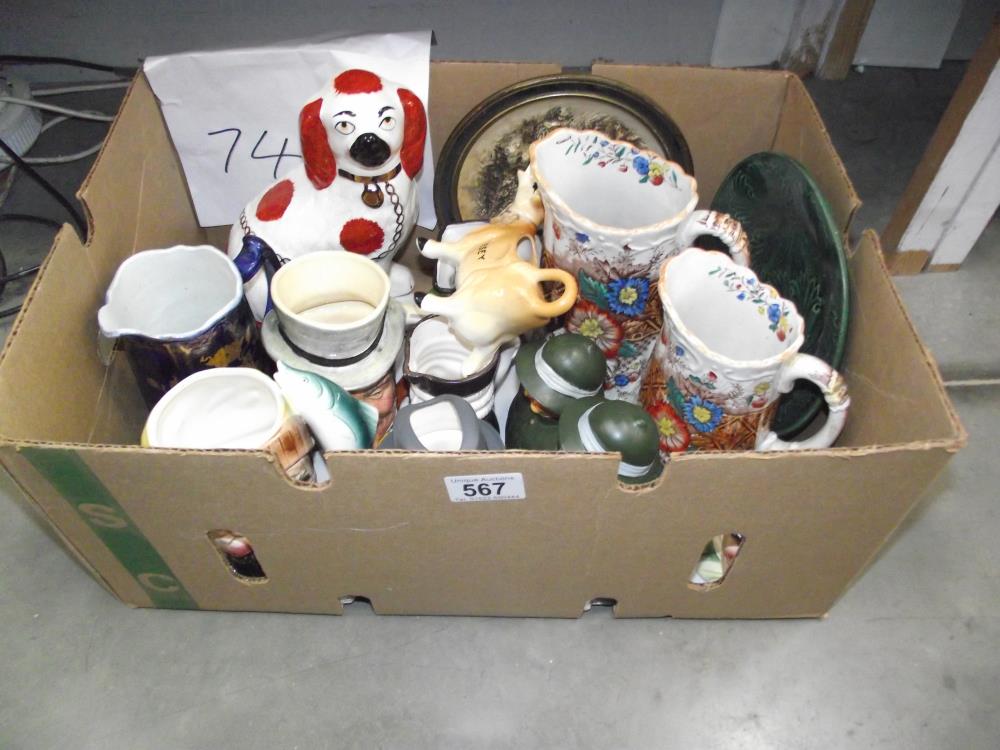 A mixed lot of pottery including character jugs, Jersey cow creamer etc.