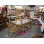 A solid pine kitchen table with 6 chairs, (collect only).