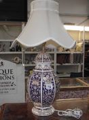 A large oriental style urn table lamp with shade made by Panda.
