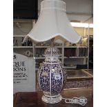 A large oriental style urn table lamp with shade made by Panda.
