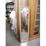 A limed oak effect floor standing mirror, (collect only).