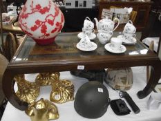 An oriental carved top table with glass inset top (collect only).