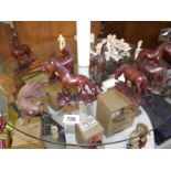 A quantity of carved wooden animals.