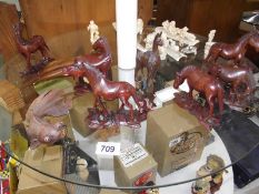 A quantity of carved wooden animals.