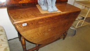 An oak gate leg table.