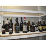 A large shelf of various alcohol.
