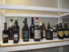 A large shelf of various alcohol.
