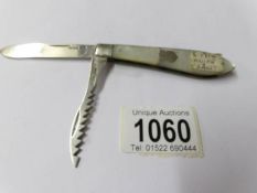 A silver and mother of pearl twin bladed pocket knife/saw, Sheffield 1914.