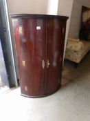 A Victorian mahogany corner cupboard.