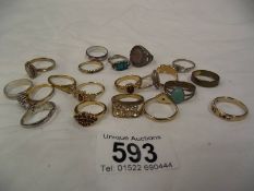 Approximately 20 yellow and white metal rings.