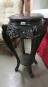 An antique carved Chinese pot/lamp stand. (collect only).