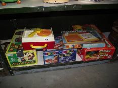 A quantity of old children's toys including Fisher Price music box record player.