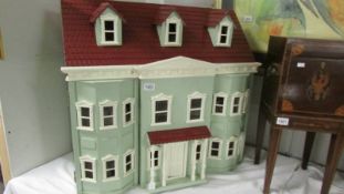 A dolls house and a boxed set of Alberon doll house dolls,