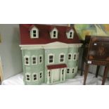 A dolls house and a boxed set of Alberon doll house dolls,