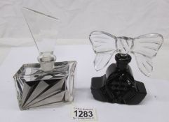 2 fine glass perfume bottles.