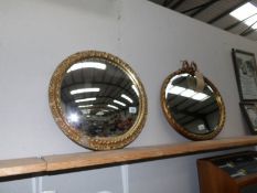 2 vintage mirrors, one oval and one round.