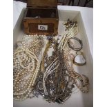 A mixed lot of costume jewellery and a small casket.