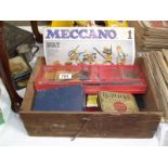 A wooden box of old meccano.