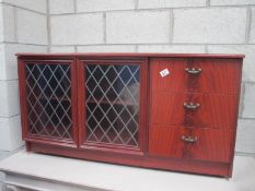 A modern cabinet with lead glass doors