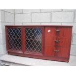 A modern cabinet with lead glass doors